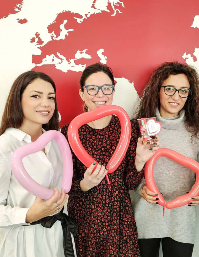 three women smiling malta heart balloon